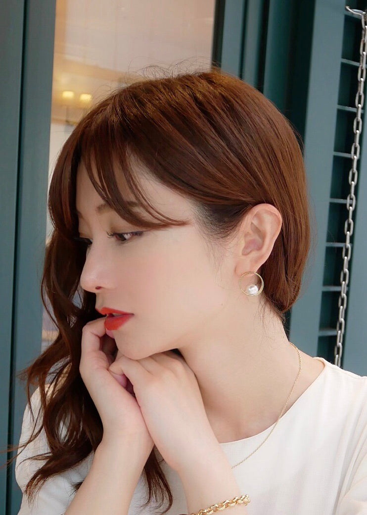 Hoop pearl pierce.