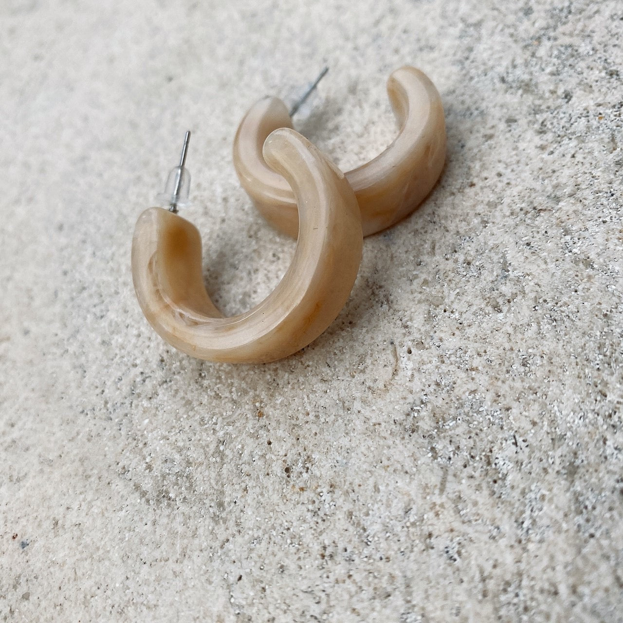 Marble stone half hoop pierces.