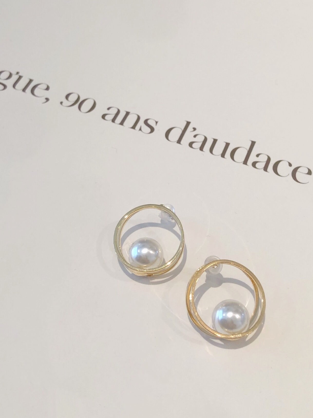 Hoop pearl pierce.