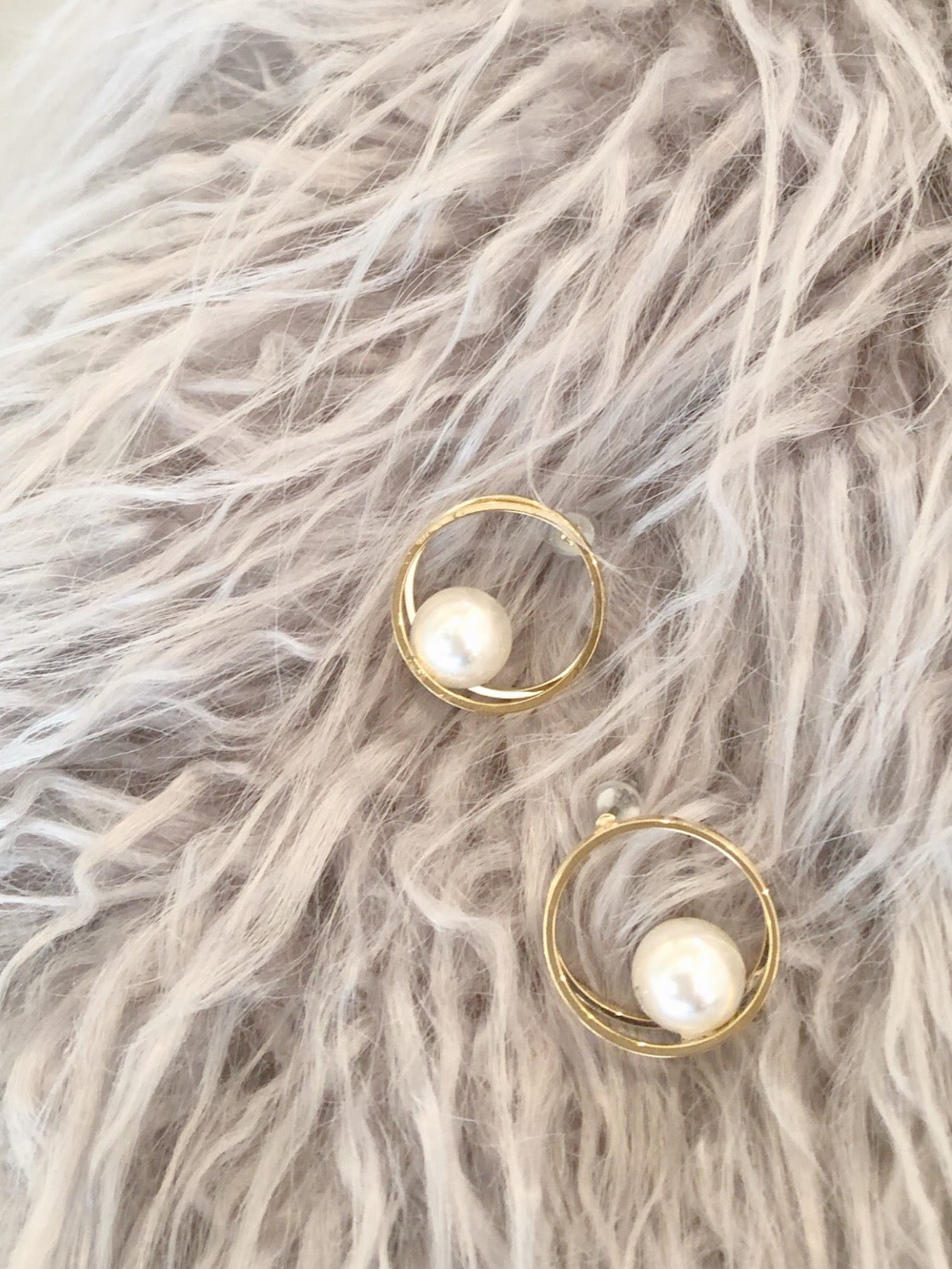 Hoop pearl pierce.