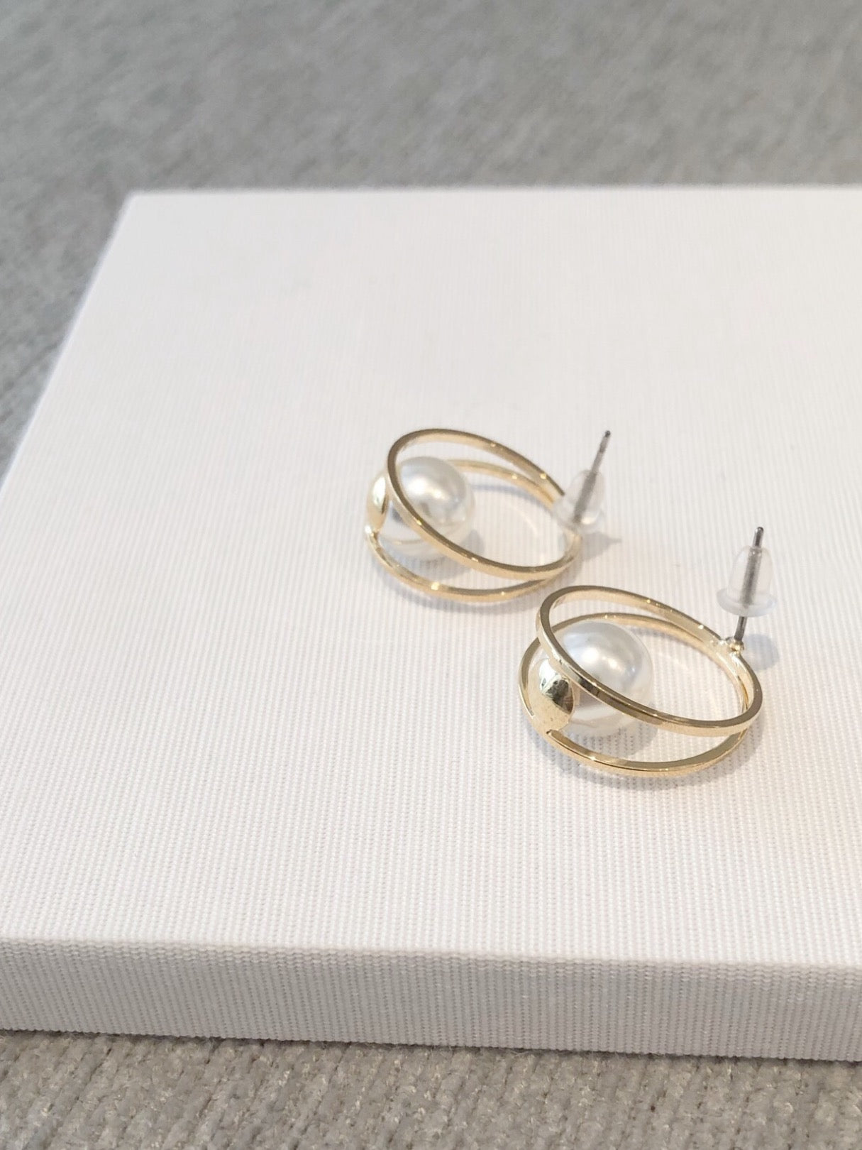 Hoop pearl pierce.