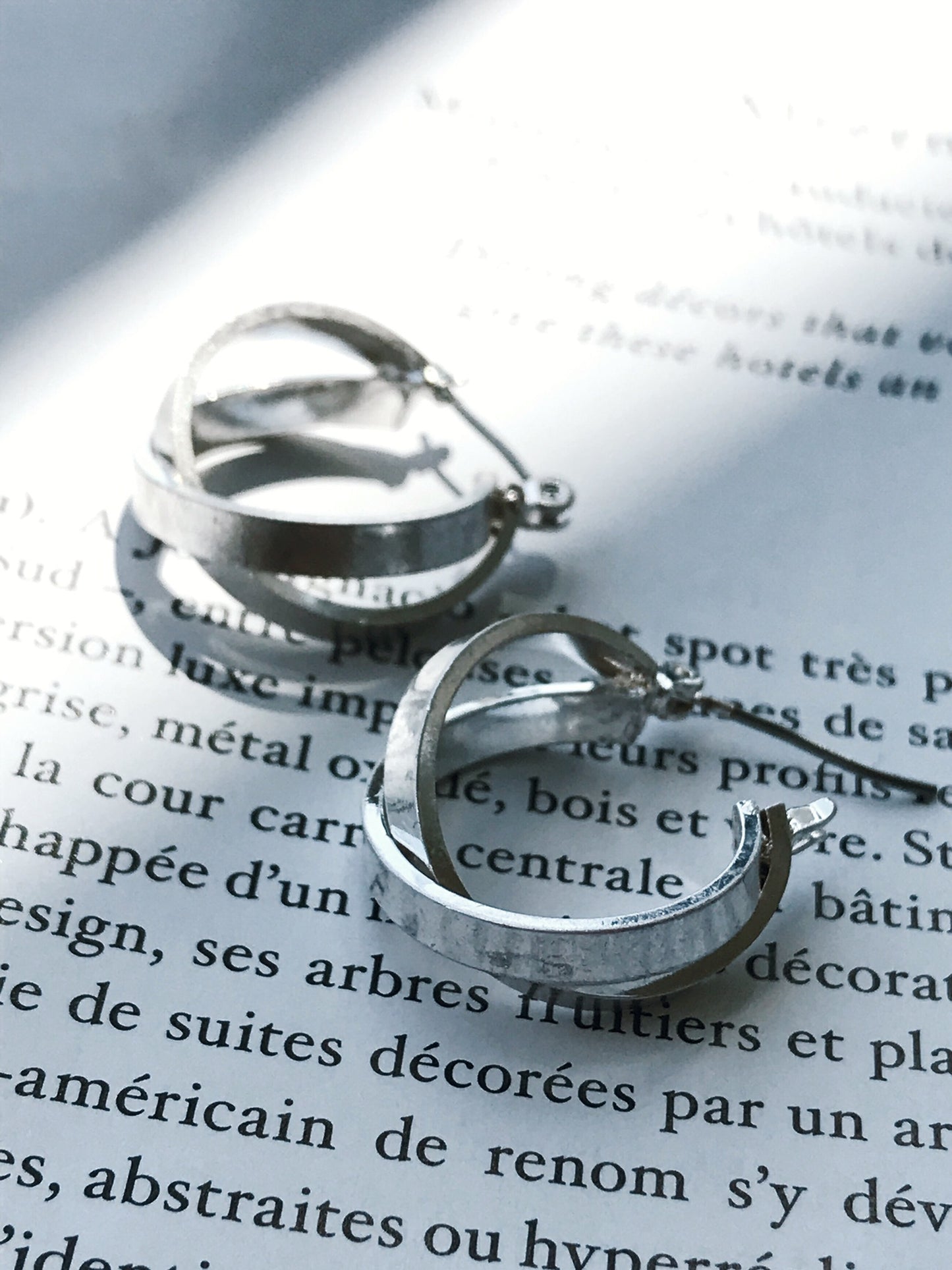 Cross hoop pierce