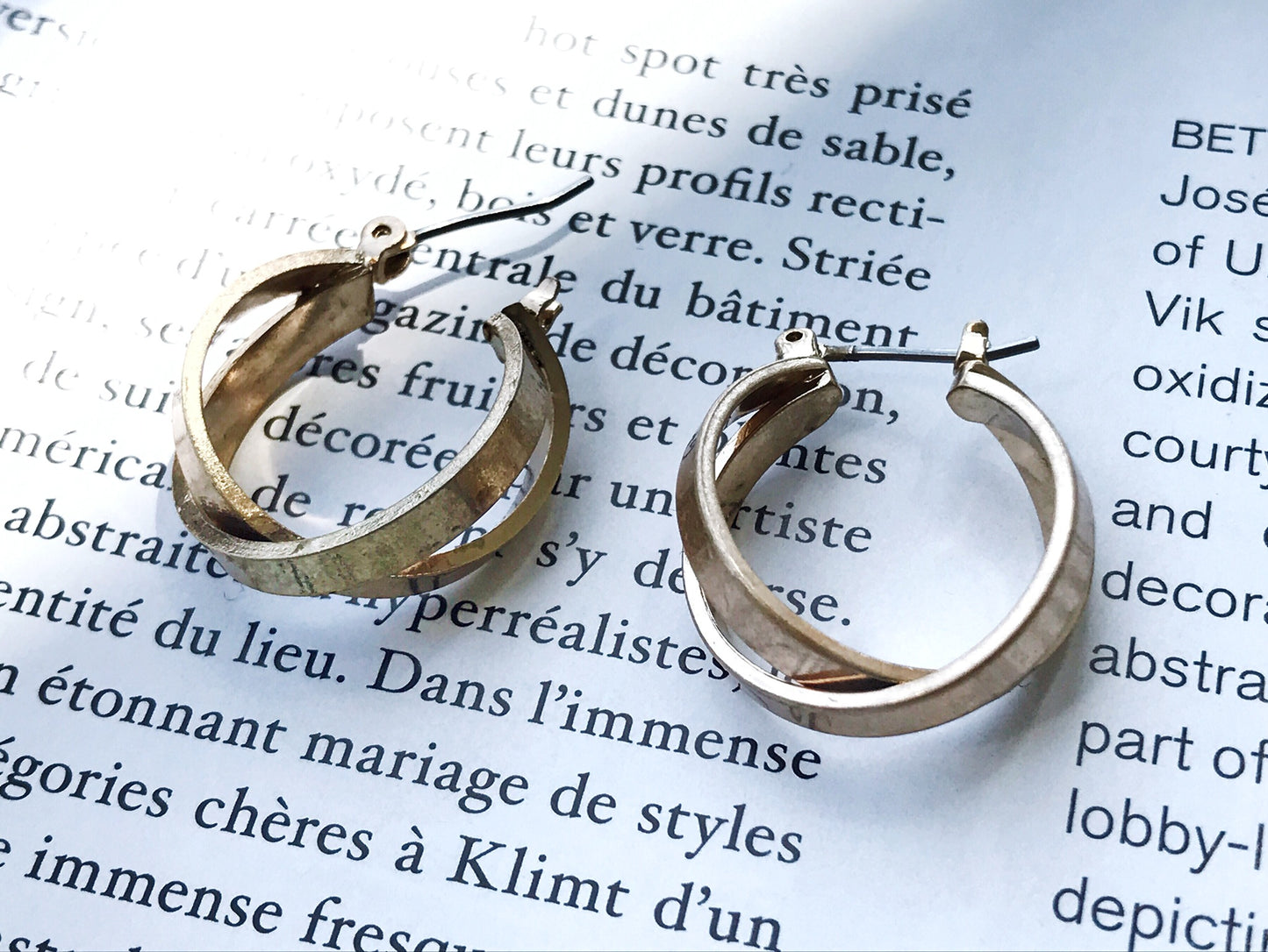 Cross hoop pierce