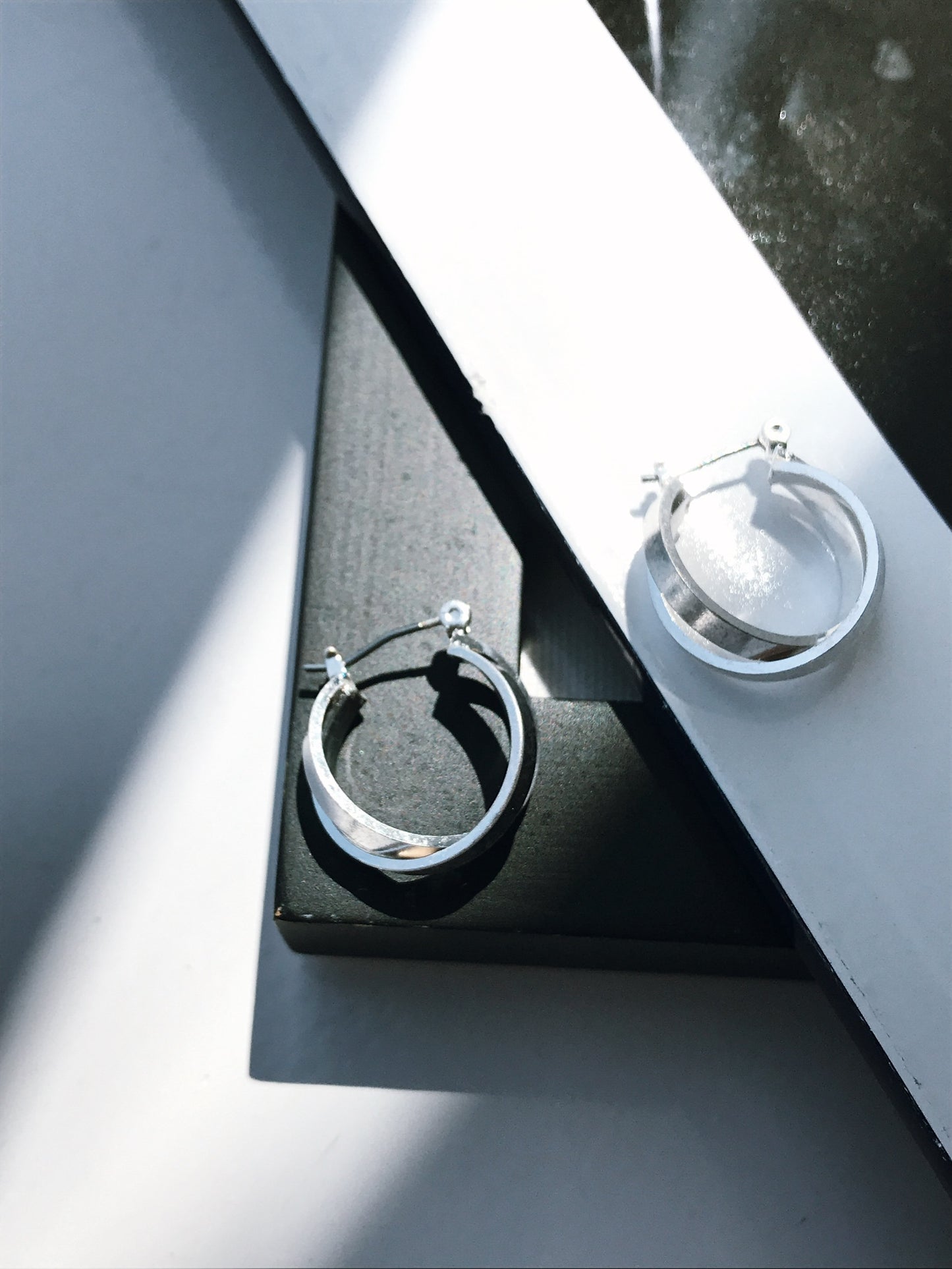Cross hoop pierce