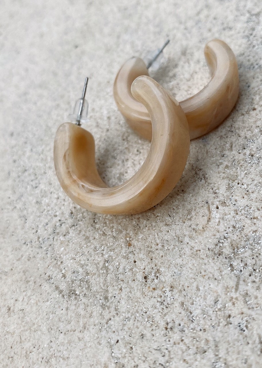 Marble stone half hoop pierces.